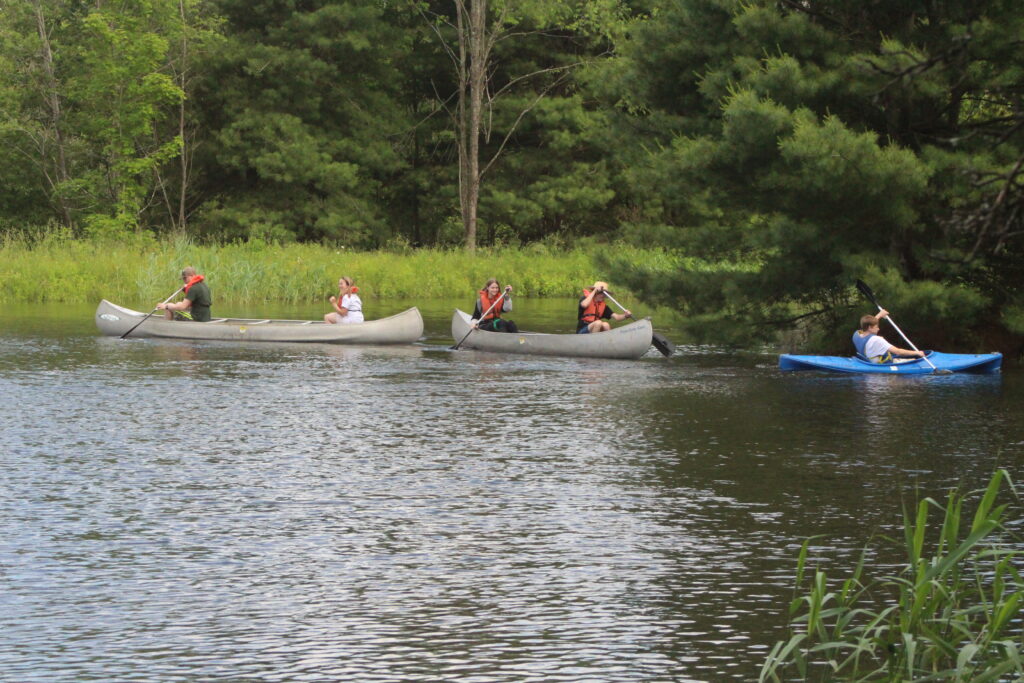 teenagers canoeing and kayaking